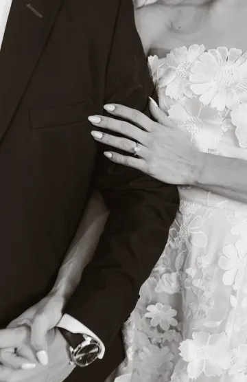 Wedding couple smiling in soft indoor light