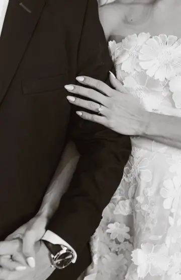 Wedding couple smiling in soft indoor light
