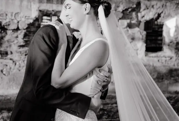 Black and white wedding kiss portrait